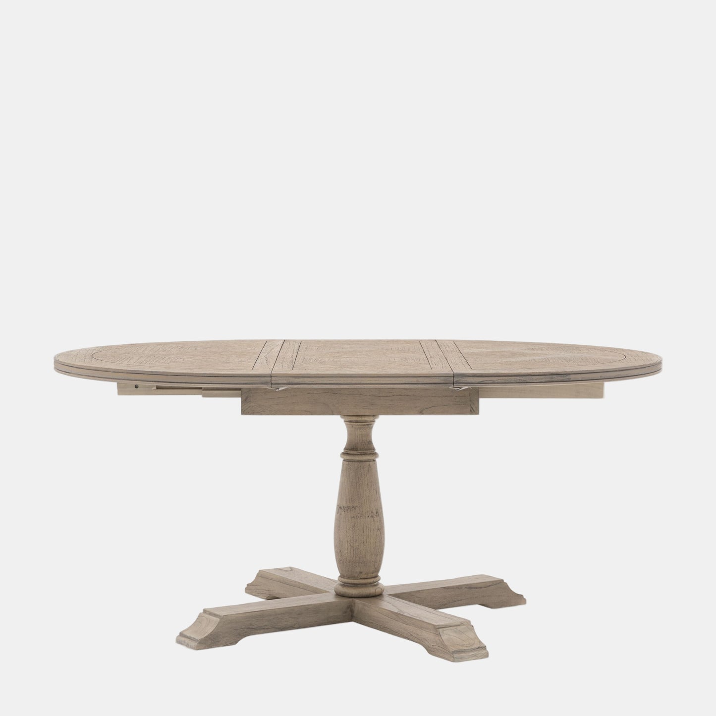 Round wooden dining table with a pedestal base on a white background