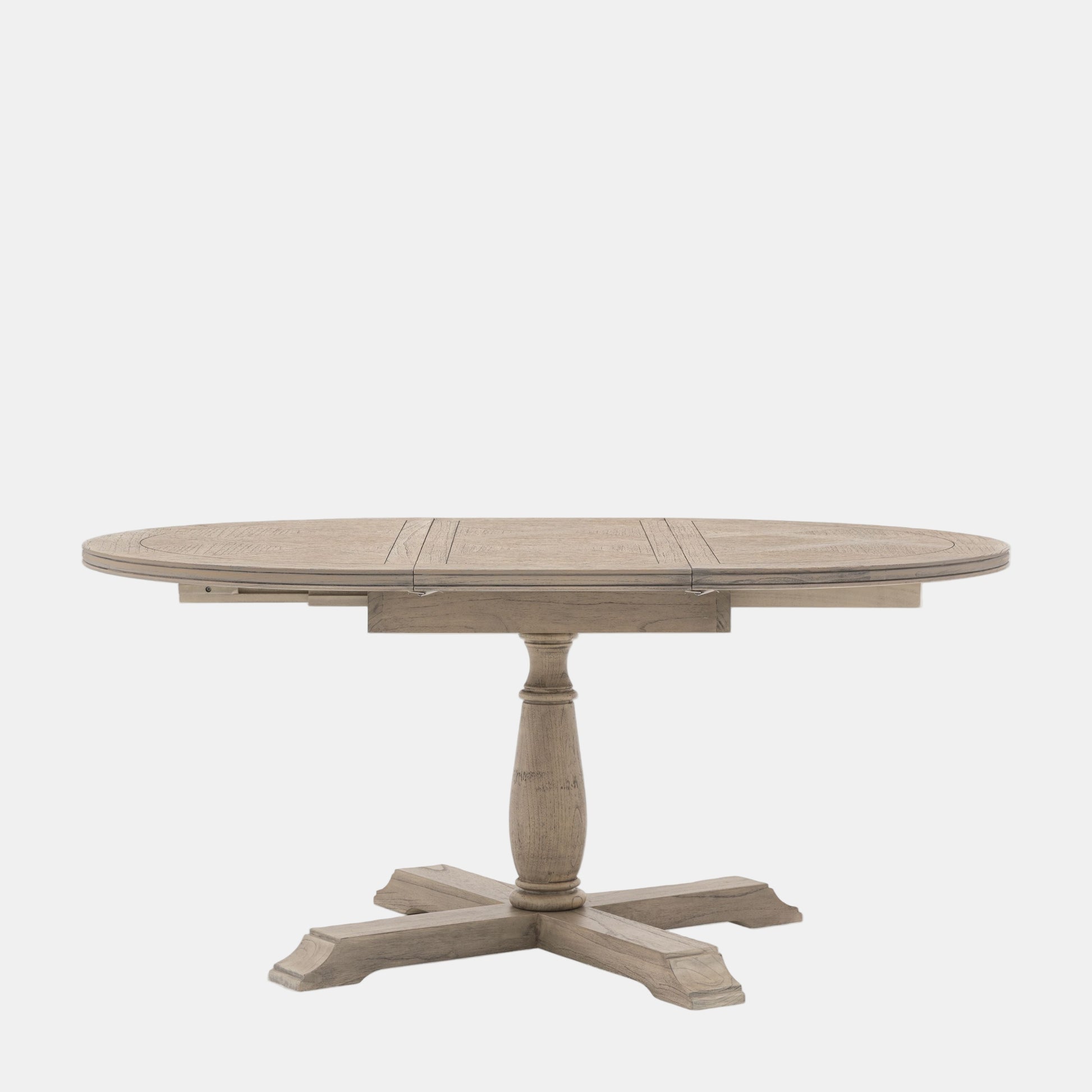 Round wooden dining table with a pedestal base on a white background