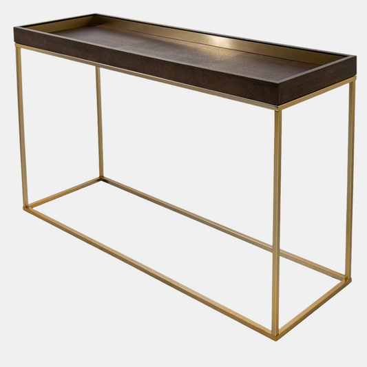 Console table with dark wood top and gold metal frame on a white background