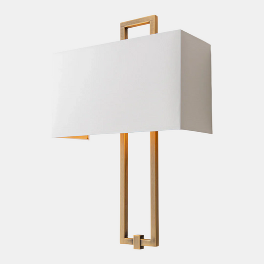 Modern wall lamp with white shade and gold metal frame on a white background